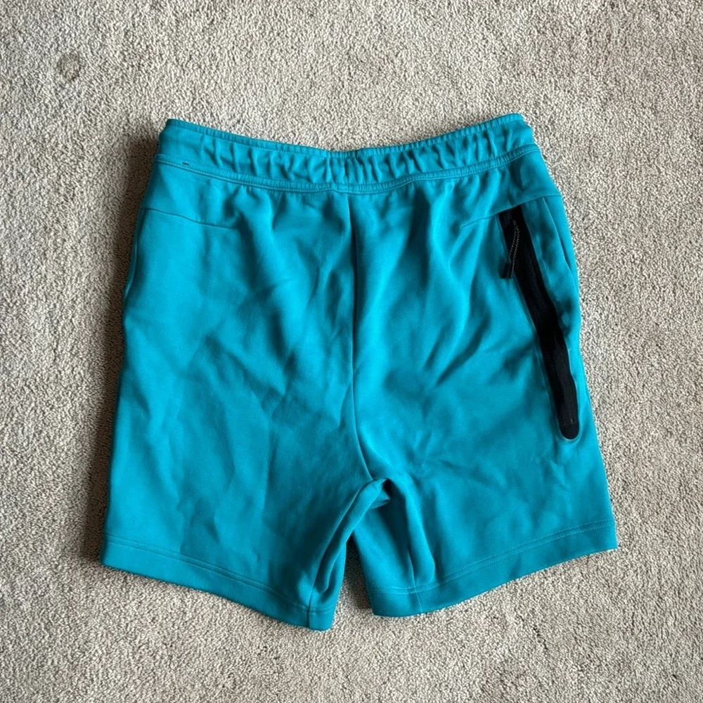 Nike Men's Teal Shorts with Red Logo
